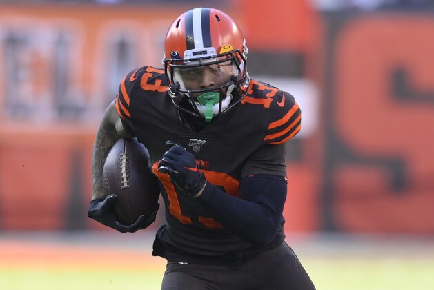 Cleveland Browns wide receiver Odell Beckham Jr. runs with the ball during an NFL football game against the Baltimore Ravens, Sunday, Dec. 22, 2019, in Cleveland. The Ravens won 31-15. (AP Photo/David Richard)