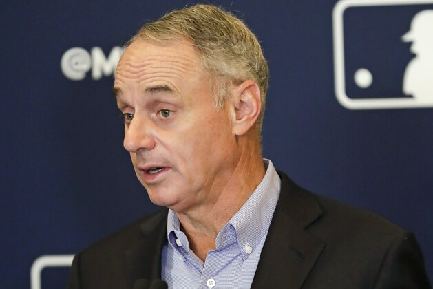 FILE - In this Feb. 8, 2019, file photo, Rob Manfred, commissioner of Major League Baseball, speaks during a news conference at owners meetings in Orlando, Fla. Players' union head Tony Clark criticized baseball Commissioner Rob Manfred for blaming players’ demands for the slow free agent market and said an increasing number of teams make little effort to