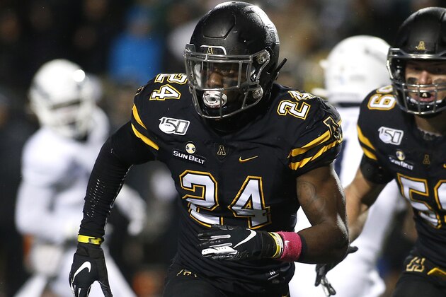 Appalachian State linebacker Akeem Davis-Gaither (24) tracks the offense during the first half of the team's NCAA college football game against Georgia Southern on Thursday, Oct. 31, 2019, in Boone, N.C. (AP Photo/Brian Blanco)