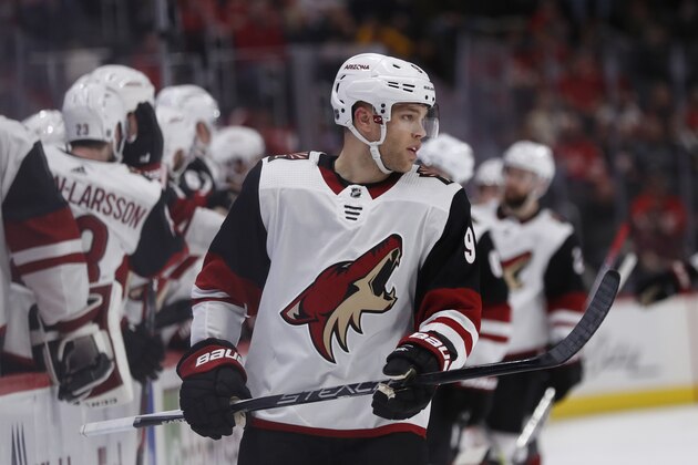 Arizona Coyotes left wing Taylor Hall skates away from the bench after receiving high-fives for scoring during the third period of an NHL hockey game against the Detroit Red Wings, Sunday, Dec. 22, 2019, in Detroit. (AP Photo/Carlos Osorio)
