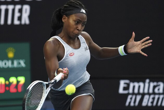 Coco Gauff of the U.S. makes a forehand return to Japan's Naomi Osaka during their third round singles match at the Australian Open tennis championship in Melbourne, Australia, Friday, Jan. 24, 2020. (AP Photo/Lee Jin-man)