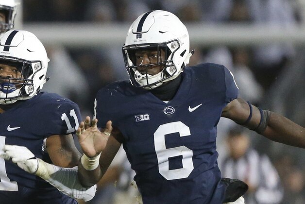 Iowa quarterback Nate Stanley (4) is pressured by Penn State's Micah Parson (11) and Cam Brown (6) as he throws during the second half of an NCAA college football game in State College, Pa., Saturday, Oct. 27, 2018. Penn State won 30-24. (AP Photo/Chris Knight)