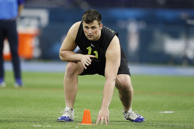 Boise State offensive lineman Ezra Cleveland runs a drill at the NFL football scouting combine in Indianapolis, Friday, Feb. 28, 2020. (AP Photo/Charlie Neibergall)