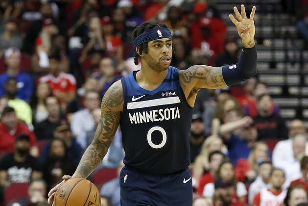 HOUSTON, TEXAS - MARCH 10: D'Angelo Russell #0 of the Minnesota Timberwolves brings the ball up court in the second half against the Houston Rockets at Toyota Center on March 10, 2020 in Houston, Texas.  NOTE TO USER: User expressly acknowledges and agrees that, by downloading and or using this photograph, User is consenting to the terms and conditions of the Getty Images License Agreement. (Photo by Tim Warner/Getty Images)