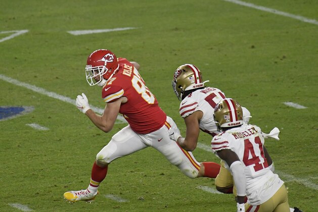 MIAMI, FLORIDA - FEBRUARY 02: Travis Kelce #87 of the Kansas City Chiefs runs with the ball after catching a pass against the San Francisco 49ers in Super Bowl LIV at Hard Rock Stadium on February 02, 2020 in Miami, Florida. The Chiefs won the game 31-20. (Photo by Focus on Sport/Getty Images)