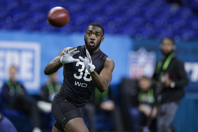 Baylor wide receiver Denzel Mims runs a drill at the NFL football scouting combine in Indianapolis, Thursday, Feb. 27, 2020. (AP Photo/Michael Conroy)