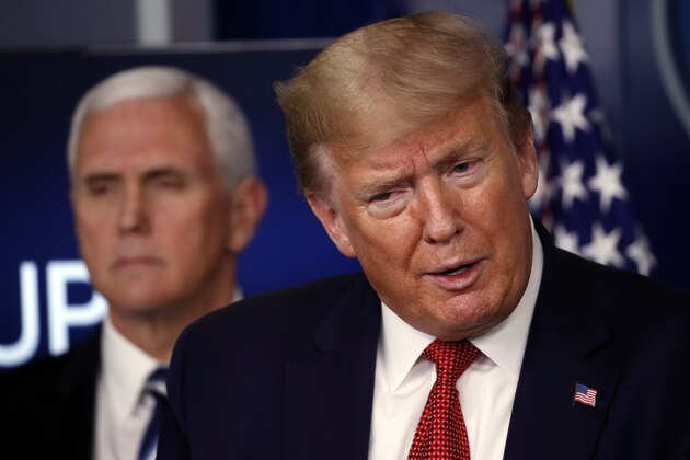 President Donald Trump speaks about the coronavirus in the James Brady Press Briefing Room of the White House, Thursday, April 16, 2020, in Washington, as Vice President Mike Pence listens. (AP Photo/Alex Brandon)