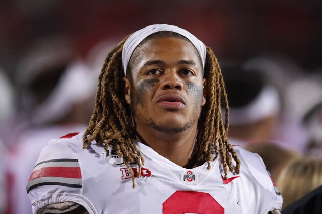 FILE - In this Oct. 18, 2019, file photo, Ohio State defensive end Chase Young looks at the scoreboard during the second half of an NCAA college football game against Northwestern, in Evanston, Ill.  Ohio State said, Wednesday, Nov. 13, 2019, the NCAA has concluded that star DE Chase Young must sit out one more football game before he can return.(AP Photo/Charles Rex Arbogast, File)