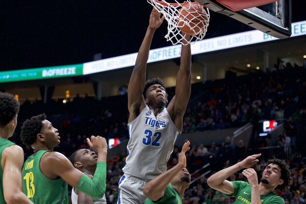 Memphis center James Wiseman (32) dunks against Oregon during the second half of an NCAA college basketball game in Portland, Ore., Tuesday, Nov. 12, 2019. Oregon won 82-74. (AP Photo/Craig Mitchelldyer)