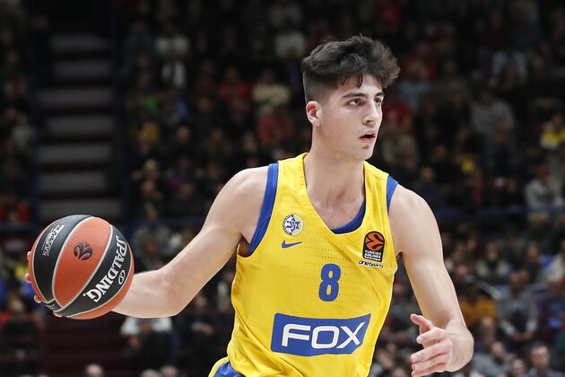 Maccabi Fox Tel Aviv's Deni Avdija controls the ball during the Euro League basketball match between Olimpia Milan and Maccabi Fox Tel Aviv, in Milan, Italy, Tuesday, Nov. 19, 2019. (AP Photo/Antonio Calanni)