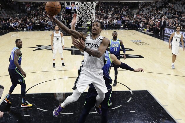 San Antonio Spurs forward DeMar DeRozan (10) scores against the Dallas Mavericks during the second half of an NBA basketball game in San Antonio, Wednesday, Feb. 26, 2020. (AP Photo/Eric Gay)