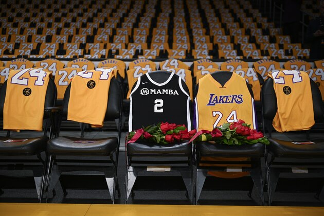 The jerseys of late Los Angeles Laker Kobe Bryant, right, and his daughter Gianna are draped on the seats the two last sat on at Staples Center, prior to the Lakers' NBA basketball game against the Portland Trail Blazers in Los Angeles, Friday, Jan. 31, 2020. The last game the two attended was on Dec. 29, 2019 when the Lakers faced the Dallas Mavericks. (AP Photo/Kelvin Kuo)