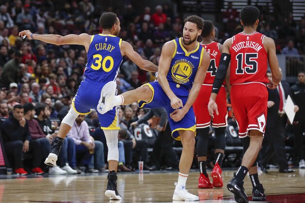 Golden State Warriors guard Klay Thompson, center, celebrates with guard Stephen Curry, left, after scoring against the Chicago Bulls during the first half of an NBA basketball game, Monday, Oct. 29, 2018, in Chicago. (AP Photo/Kamil Krzaczynski) Golden State Warriors guard Klay Thompson, center, celebrates with guard Stephen Curry, left, after scoring against the Chicago Bulls during the first half of an NBA basketball game, Monday, Oct. 29, 2018, in Chicago. (AP Photo/Kamil Krzaczynski)