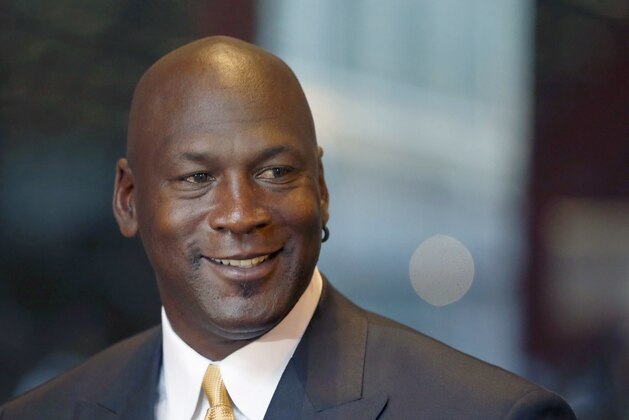 FILE - In this Aug. 21, 2015, file photo, former NBA star and current owner of the Charlotte Hornets, Michael Jordan, smiles at reporters in Chicago. Jordan has made another major donation, pledging $5 million to the Smithsonian's new African-American history museum on the National Mall, officials at the National Museum of African American History and Culture announced Monday, Aug. 8, 2016. (AP Photo/Charles Rex Arbogast, File)