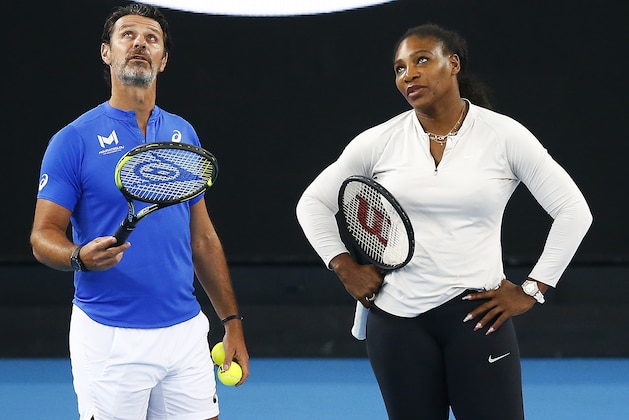 MELBOURNE, AUSTRALIA - JANUARY 17: Serena Williams of United States (R) speaks with coach Patrick Mouratoglou during practice ahead of the 2020 Australian Open at Melbourne Park on January 17, 2020 in Melbourne, Australia. (Photo by Daniel Pockett/Getty Images)