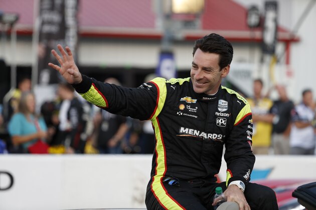Simon Pagenaud waves before the IndyCar auto race at World Wide Technology Raceway on Saturday, Aug. 24, 2019, in Madison, Ill. (AP Photo/Jeff Roberson)