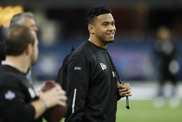 FILE - In this Feb. 27, 2020, file photo, Alabama quarterback Tua Tagovailoa watches a drill at the NFL football scouting combine in Indianapolis. In 54 years of drafting, the Miami Dolphins have taken four quarterbacks in the first round, and two are in the Pro Football Hall of Fame. (AP Photo/Charlie Neibergall, File)