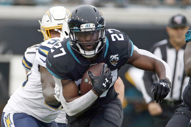Jacksonville Jaguars running back Leonard Fournette (27) runs against the Los Angeles Chargers defense during the first half of an NFL football game, Sunday, Dec. 8, 2019, in Jacksonville, Fla. (AP Photo/Stephen B. Morton)