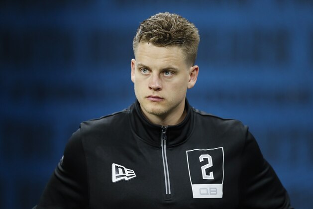 LSU quarterback Joe Burrow watches a drill at the NFL football scouting combine in Indianapolis, Thursday, Feb. 27, 2020. (AP Photo/Charlie Neibergall)