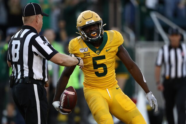 WACO, TEXAS - NOVEMBER 23:  Denzel Mims #5 of the Baylor Bears celebrates a touchdown pass reception against the Texas Longhorns in the second half at McLane Stadium on November 23, 2019 in Waco, Texas. (Photo by Ronald Martinez/Getty Images)