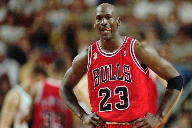 FILE - In this June 9, 1996 file photo Chicago Bulls Michael Jordan stands during a break at the end of an NBA Basketball game against the Seattle SuperSonics in Seattle. A Bismarck, N.D., man who used to own McDonald's restaurants is about $10,000 richer after selling a 20-year-old container of McJordan barbecue sauce Monday, Oct. 15, 2012, to a buyer in Chicago. The sauce was used on McJordan Burgers, named for basketball icon in limited markets for a short time in the 1990s, when Jordan led the Chicago Bulls to six NBA championships. (AP Photo/Beth A. Keiser, File)