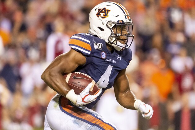 Auburn defensive back Noah Igbinoghene (4) runs back a kick against Alabama during the second half of an NCAA college football game, Saturday, Nov. 30, 2019, in Auburn, Ala. (AP Photo/Vasha Hunt)