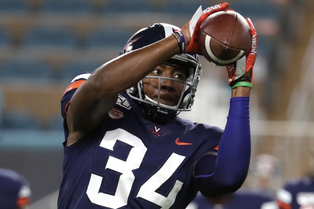 Virginia cornerback Bryce Hall (34) does drills before an NCAA college football game against Miami, Friday, Oct. 11, 2019, in Miami Gardens, Fla. (AP Photo/Lynne Sladky)
