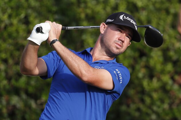 Brian Harman watches his drive from the first tee during the opening round of the Sanderson Farms Championship golf tournament in Jackson, Miss., Thursday, Sept. 19, 2019. (AP Photo/Rogelio V. Solis)