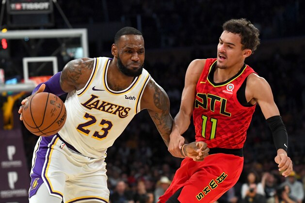 LOS ANGELES, CALIFORNIA - NOVEMBER 11: LeBron James #23 of the Los Angeles Lakers is fouled by Trae Young #11 of the Atlanta Hawks as he drives to the basket in the fourth quarter of the game at Staples Center on November 11, 2018 in Los Angeles, California. NOTE TO USER: User expressly acknowledges and agrees that, by downloading and or using this photograph, User is consenting to the terms and conditions of the Getty Images License Agreement. (Photo by Jayne Kamin-Oncea/Getty Images) LOS ANGELES, CALIFORNIA - NOVEMBER 11: LeBron James #23 of the Los Angeles Lakers is fouled by Trae Young #11 of the Atlanta Hawks as he drives to the basket in the fourth quarter of the game at Staples Center on November 11, 2018 in Los Angeles, California. NOTE TO USER: User expressly acknowledges and agrees that, by downloading and or using this photograph, User is consenting to the terms and conditions of the Getty Images License Agreement. (Photo by Jayne Kamin-Oncea/Getty Images)
