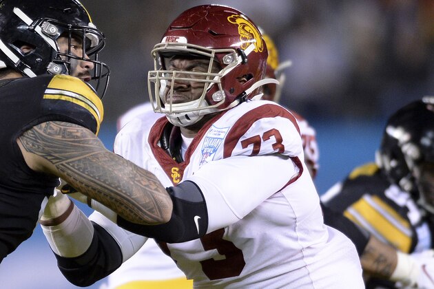 Iowa defensive end A.J. Epenesa (94) works against Southern California offensive tackle Austin Jackson (73) during the first half of the Holiday Bowl NCAA college football game Friday, Dec. 27, 2019, in San Diego. (AP Photo/Orlando Ramirez)