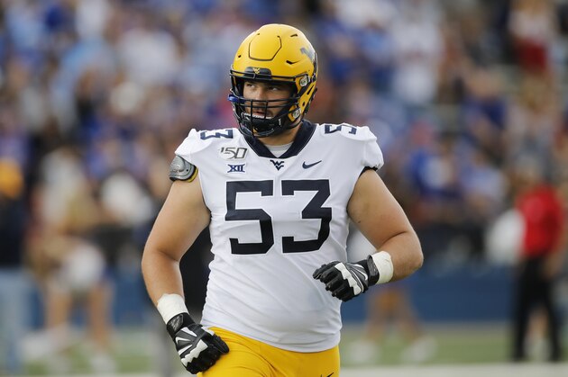 West Virginia offensive lineman Colton McKivitz (53) during an NCAA football game against Kansas on Saturday, Sept. 21, 2019 in Lawrence, Kan. (AP Photo/Colin E. Braley)