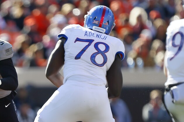 STILLWATER, OK - NOVEMBER 16:  Defensive end Mike Scott #91 of the Oklahoma State Cowboys rushes to get past offensive lineman Hakeem Adeniji #78 of the Kansas Jayhawks in the fourth quarter on November 16, 2019 at Boone Pickens Stadium in Stillwater, Oklahoma.  OSU won 31-13.  (Photo by Brian Bahr/Getty Images)