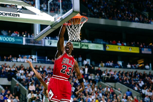 BOSTON - DECEMBER 18:  Michael Jordan #23 of the Chicago Bulls dunks the ball against the Boston Celtics during the NBA game at the FleetCenter on December 18, 1995 in Boston, Massachusetts.  NOTE TO USER: User expressly acknowledges and agrees that, by downloading and/or using this Photograph, User is consenting to the terms and conditions of the Getty Images License Agreement.  Mandatory Copyright Notice:  Copyright 1995 NBAE  (Photo by Nathaniel S. Butler/NBAE via Getty Images)