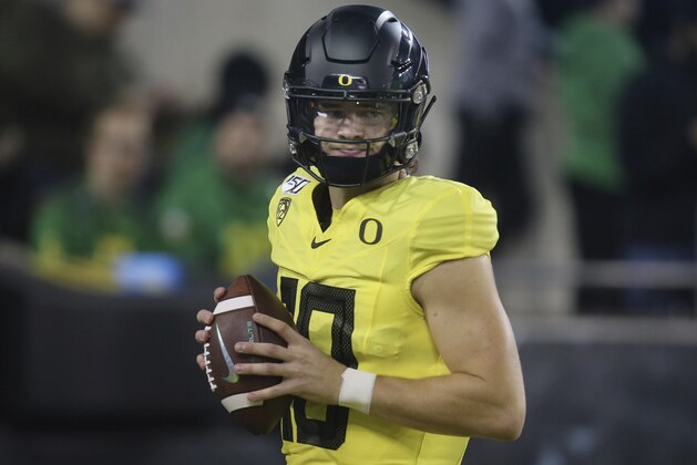 Oregon quarterback Justin Herbert warms up before an NCAA college football game against Arizona, Saturday, Nov. 16, 2019, in Eugene, Ore. (AP Photo/Chris Pietsch)