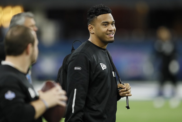 FILE - In this Feb. 27, 2020, file photo, Alabama quarterback Tua Tagovailoa watches a drill at the NFL football scouting combine in Indianapolis. In 54 years of drafting, the Miami Dolphins have taken four quarterbacks in the first round, and two are in the Pro Football Hall of Fame. (AP Photo/Charlie Neibergall, File)