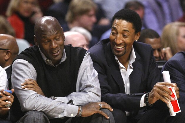 Chicago Bulls' greats Michael Jordan, left, and Scottie Pippen sit court side during the first half of an NBA basketball game between the Chicago Bulls and the Charlotte Bobcats Tuesday, Feb. 15, 2011, in Chicago. (AP Photo/Charles Rex Arbogast)