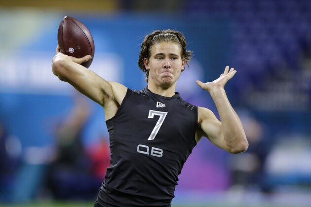 Oregon quarterback Justin Herbert runs a drill at the NFL football scouting combine in Indianapolis, Thursday, Feb. 27, 2020. (AP Photo/Michael Conroy)