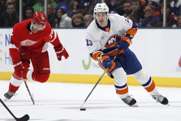 New York Islanders center Mathew Barzal (13) skates with the puck as Detroit Red Wings left wing Andreas Athanasiou (72) pursues during the second period of an NHL hockey game Friday, Feb. 21, 2020, in Uniondale, N.Y. (AP Photo/Kathy Willens)