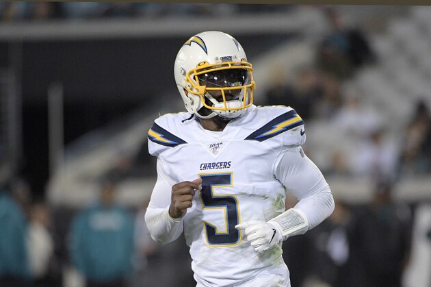 Los Angeles Chargers quarterback Tyrod Taylor (5) jogs to the sideline after a play during the second half of an NFL football game against the Jacksonville Jaguars Sunday, Dec. 8, 2019, in Jacksonville, Fla. (AP Photo/Phelan M. Ebenhack)