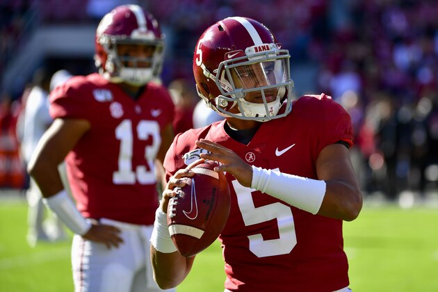 Alabama quarterback Taulia Tagovailoa (5) warms up with his brother, Alabama quarterback Tua Tagovailoa (13) in the background, before an NCAA football game against LSU Saturday, Nov. 9, 2019, in Tuscaloosa, Ala. (AP Photo/Vasha Hunt)