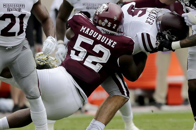 Texas A&M defensive lineman Justin Madubuike (52) brings down Mississippi State running back Kylin Hill (8) after a short gain during the first quarter of an NCAA college football game, Saturday, Oct. 26, 2019, in College Station, Texas. (AP Photo/Sam Craft) Texas A&M defensive lineman Justin Madubuike (52) brings down Mississippi State running back Kylin Hill (8) after a short gain during the first quarter of an NCAA college football game, Saturday, Oct. 26, 2019, in College Station, Texas. (AP Photo/Sam Craft)