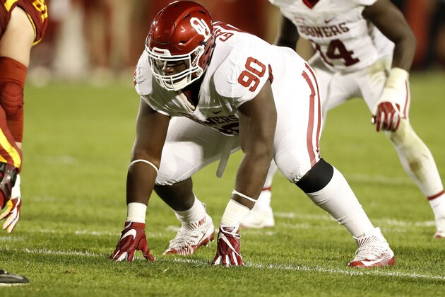 Oklahoma defensive lineman Neville Gallimore (90) gets set for a play during the first half of an NCAA college football game against Iowa State, Thursday, Nov. 3, 2016, in Ames, Iowa. (AP Photo/Charlie Neibergall)