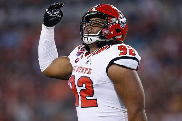 JACKSONVILLE, FL - DECEMBER 31:  Larrell Murchison #92 of the North Carolina State Wolfpack reacts against the Texas A&M Aggies during the TaxSlayer Gator Bowl at TIAA Bank Field on December 31, 2018 in Jacksonville, Florida.  (Photo by Michael Reaves/Getty Images)