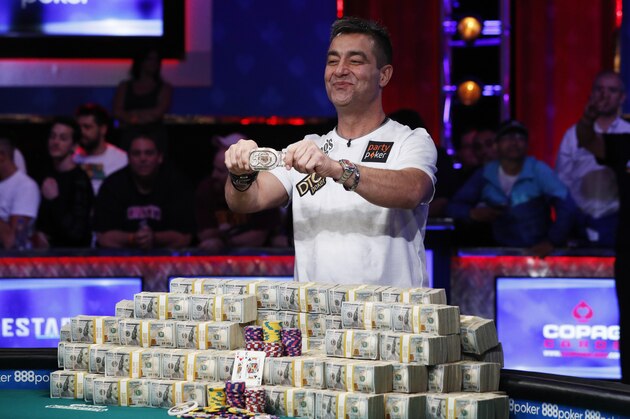 Hossein Ensan, of Germany, poses with the bracelet after winning the World Series of Poker main event, Wednesday, July 17, 2019, in Las Vegas. (AP Photo/John Locher)
