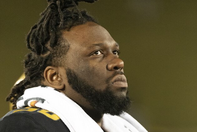 Missouri defensive lineman Antar Thompson watches the final minutes of their 24-20 loss to Tennessee during the fourth quarter of an NCAA college football game Saturday, Nov. 23, 2019, in Columbia, Mo. (AP Photo/L.G. Patterson)