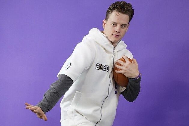 LSU quarterback Joe Burrow poses during media day for NCAA College Football Playoff national championship game Saturday, Jan. 11, 2020, in New Orleans. Clemson is scheduled to play LSU on Monday. (AP Photo/David J. Phillip).