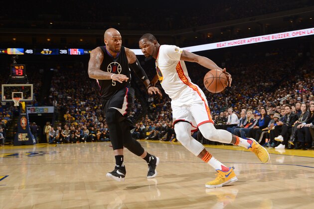 OAKLAND, CA - JANUARY 28: Kevin Durant #35 of the Golden State Warriors drives to the basket against Marreese Speights #5 of the LA Clippers during the game on January 28, 2017 at ORACLE Arena in Oakland, California. NOTE TO USER: User expressly acknowledges and agrees that, by downloading and or using this photograph, user is consenting to the terms and conditions of Getty Images License Agreement. Mandatory Copyright Notice: Copyright 2017 NBAE (Photo by Noah Graham/NBAE via Getty Images) OAKLAND, CA - JANUARY 28: Kevin Durant #35 of the Golden State Warriors drives to the basket against Marreese Speights #5 of the LA Clippers during the game on January 28, 2017 at ORACLE Arena in Oakland, California. NOTE TO USER: User expressly acknowledges and agrees that, by downloading and or using this photograph, user is consenting to the terms and conditions of Getty Images License Agreement. Mandatory Copyright Notice: Copyright 2017 NBAE (Photo by Noah Graham/NBAE via Getty Images)