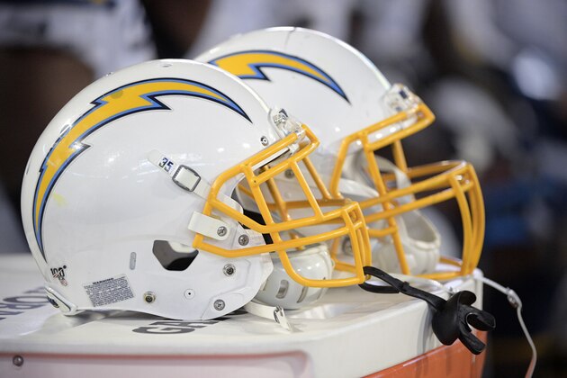 Los Angeles Chargers helmets sit on a cooler next to the bench during the second half of an NFL football game against the Jacksonville Jaguars Sunday, Dec. 8, 2019, in Jacksonville, Fla. (AP Photo/Phelan M. Ebenhack)