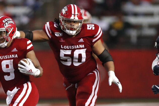 Louisiana Lafayette running back Trey Ragas (9) and offensive lineman Robert Hunt (50) during an NCAA college football game against Liberty, Saturday, September 7, 2019, in Lafayette, La. (AP Photo/Tyler Kaufman)