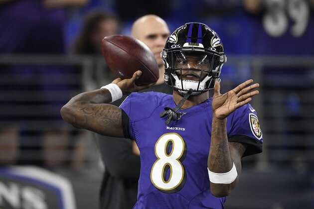 Baltimore Ravens quarterback Lamar Jackson (8) warms up before an NFL divisional playoff football game against the Tennessee Titans, Saturday, Jan. 11, 2020, in Baltimore. (AP Photo/Nick Wass)